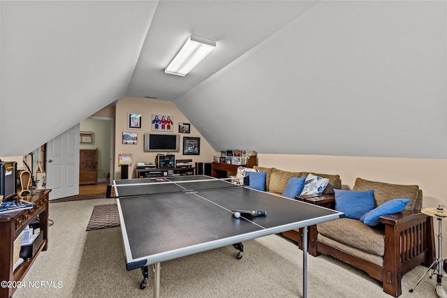 recreation room featuring lofted ceiling and carpet flooring