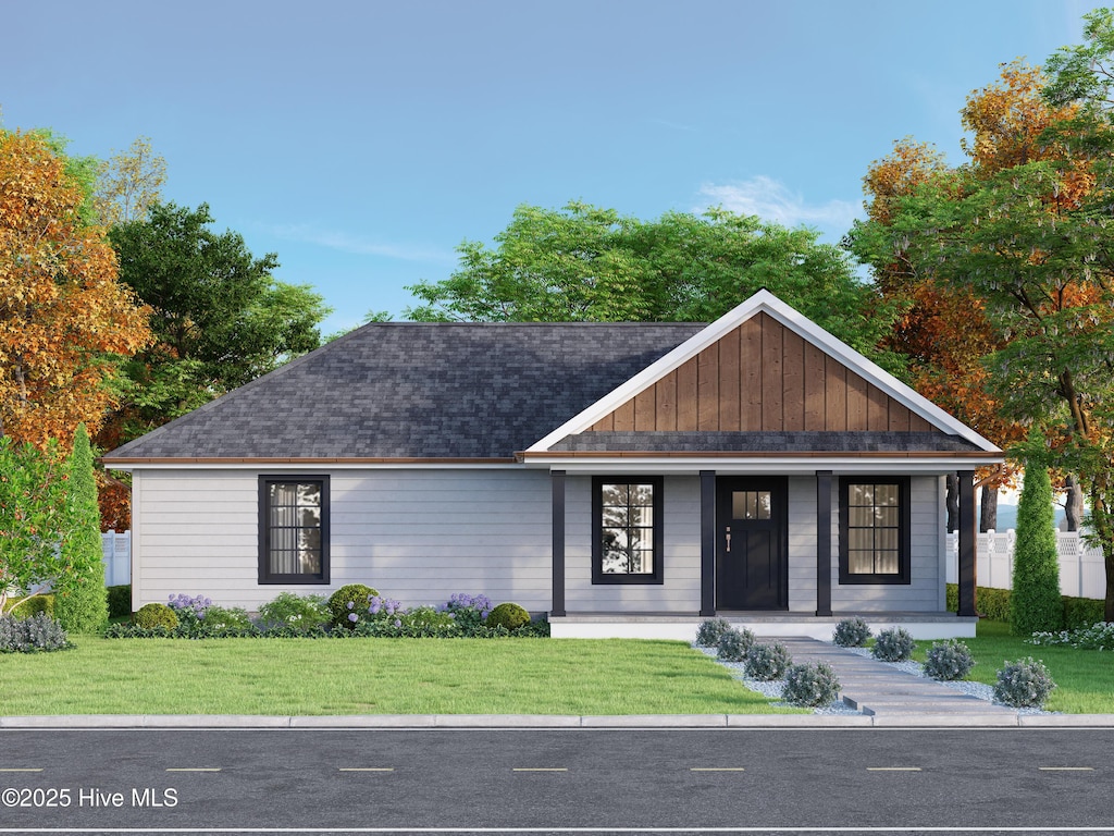 view of front of property featuring a front lawn and covered porch