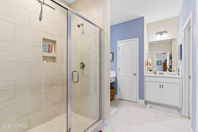 bathroom with a stall shower, marble finish floor, and vanity