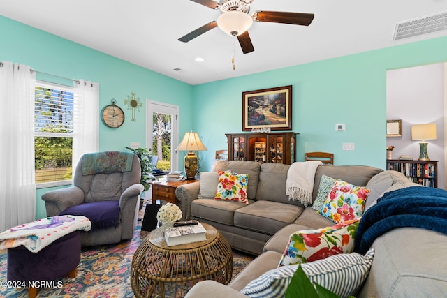 living area featuring a ceiling fan, recessed lighting, and visible vents