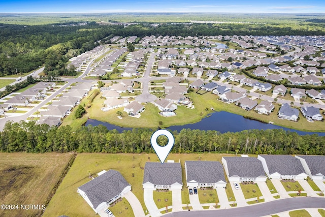 birds eye view of property with a water view and a residential view