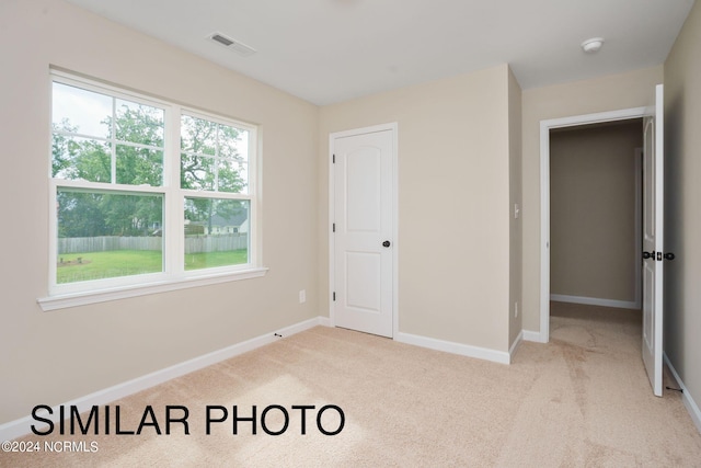 bedroom with light carpet