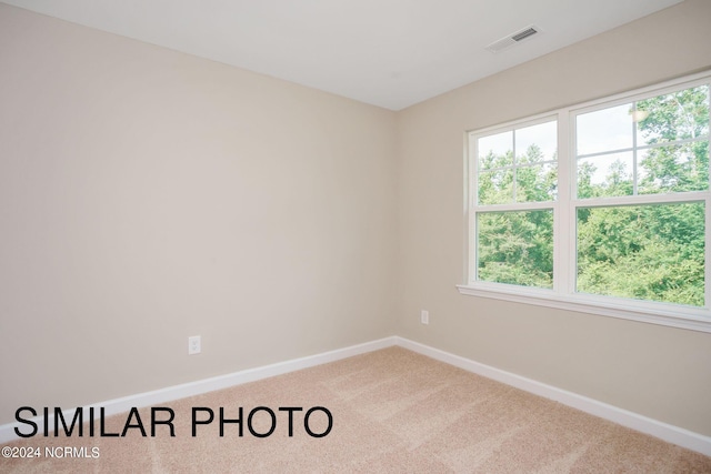 spare room with carpet flooring