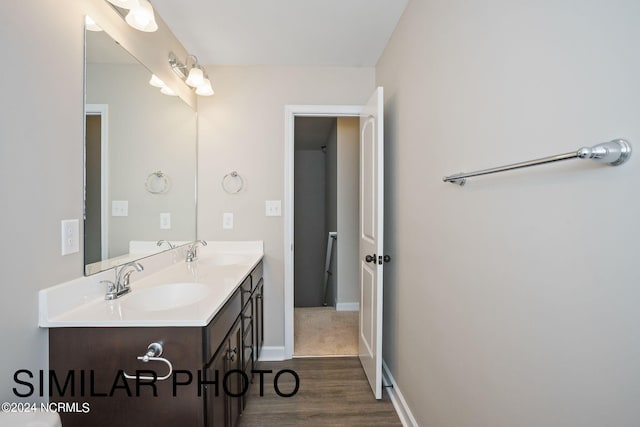 bathroom with vanity and hardwood / wood-style flooring