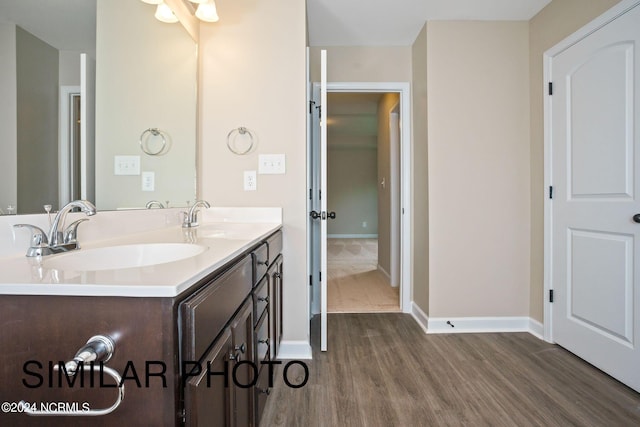 bathroom with vanity and hardwood / wood-style flooring