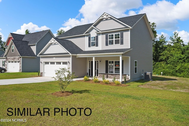 craftsman-style house featuring a front yard, a porch, and central air condition unit