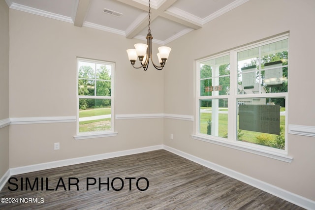 empty room featuring an inviting chandelier, beam ceiling, ornamental molding, and dark hardwood / wood-style flooring