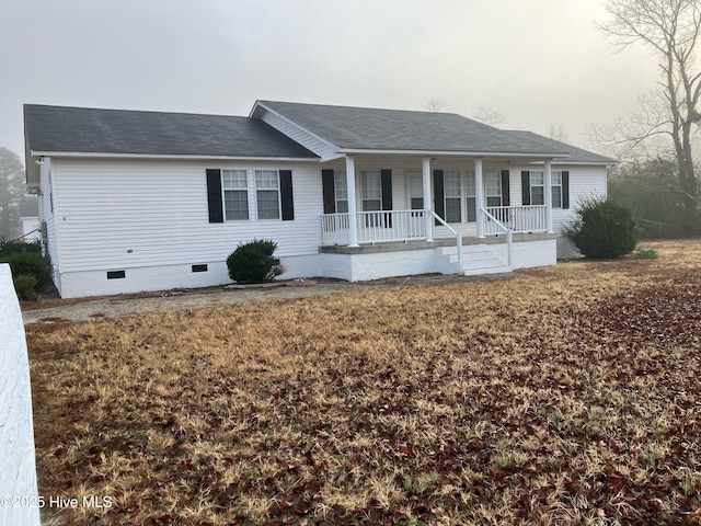 ranch-style house featuring covered porch