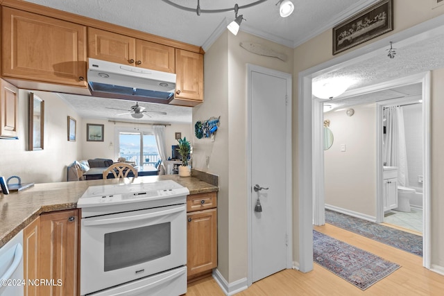 kitchen with light hardwood / wood-style floors, a textured ceiling, white appliances, ornamental molding, and ceiling fan