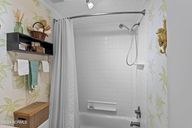 bathroom featuring shower / bath combo, a textured ceiling, and crown molding