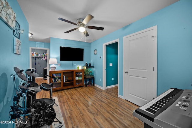 interior space with hardwood / wood-style floors and ceiling fan