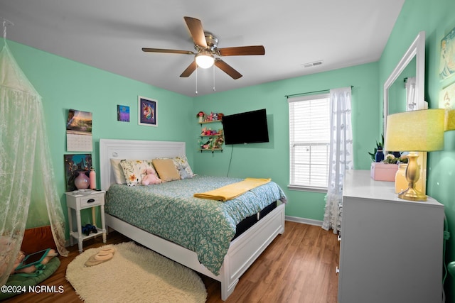 bedroom featuring hardwood / wood-style floors and ceiling fan