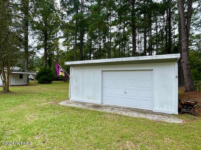 garage with a yard