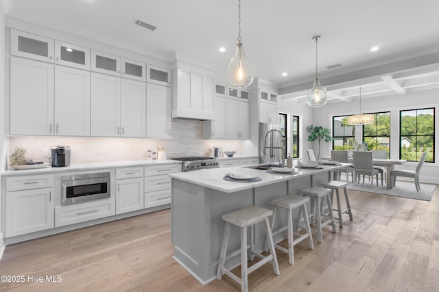 616 Waterstone Dr, Wilmington, NC 28411 - kitchen featuring appliances with stainless steel finishes, a sink, recessed lighting, backsplash, and a breakfast bar