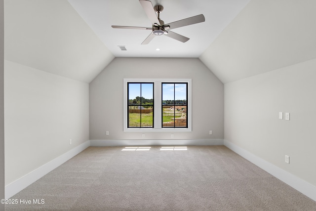 616 Waterstone Dr, Wilmington, NC 28411 - bonus room with lofted ceiling, light carpet, a ceiling fan, and baseboards