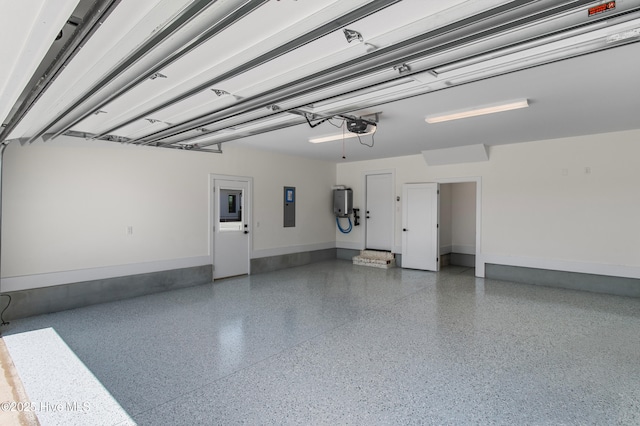 616 Waterstone Dr, Wilmington, NC 28411 - garage featuring electric panel, a garage door opener, water heater, and baseboards