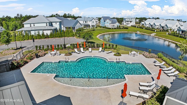 616 Waterstone Dr, Wilmington, NC 28411 - community pool with a patio area, a water view, and a residential view
