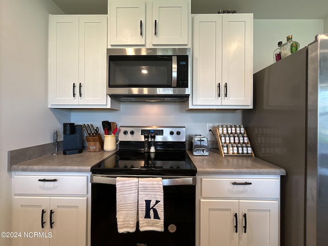 kitchen with white cabinetry and appliances with stainless steel finishes