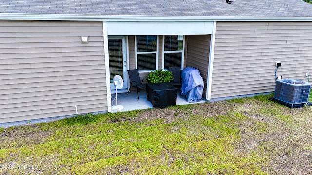 exterior space featuring central AC unit