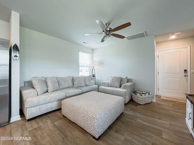 living room with ceiling fan and hardwood / wood-style flooring