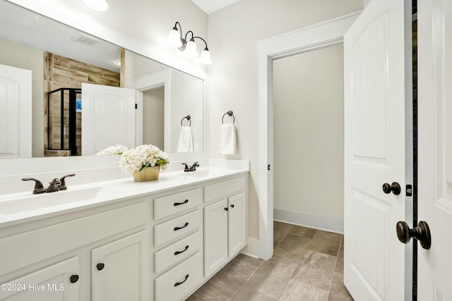 bathroom with vanity and an enclosed shower