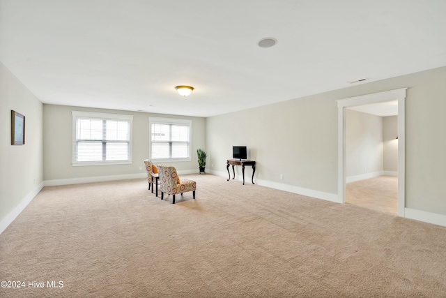 living area with light colored carpet