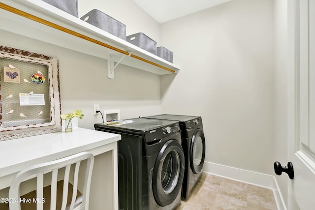 clothes washing area with washing machine and clothes dryer