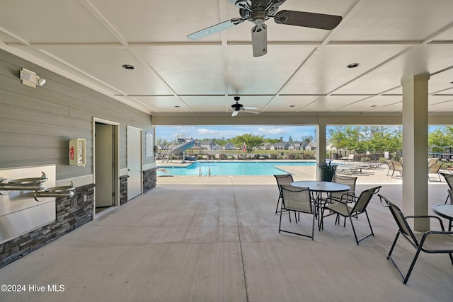 view of swimming pool with a patio area and exterior kitchen