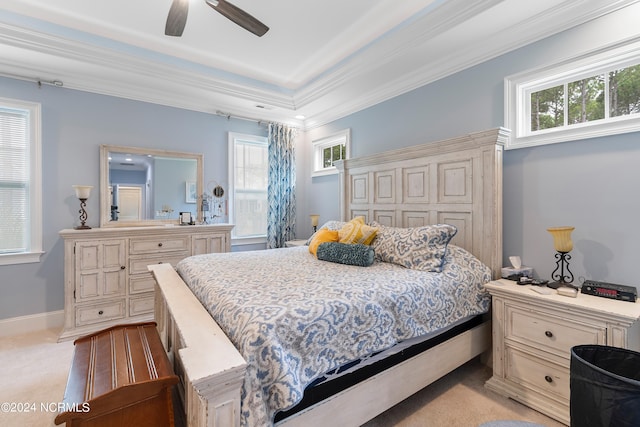 carpeted bedroom featuring ceiling fan, crown molding, and multiple windows