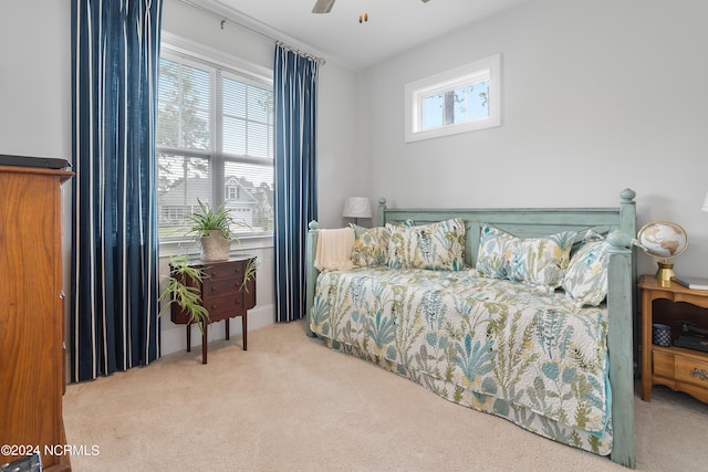 bedroom with multiple windows, carpet flooring, and ceiling fan