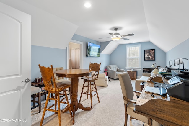 office with ceiling fan, light colored carpet, and vaulted ceiling