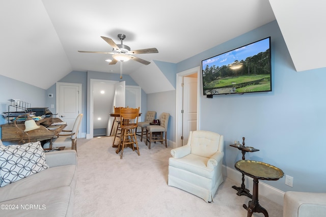 interior space with ceiling fan, carpet, and vaulted ceiling