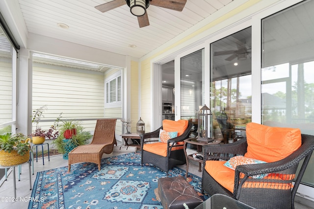 exterior space featuring a baseboard heating unit, wood ceiling, and ceiling fan