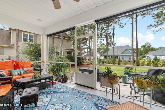 sunroom / solarium featuring ceiling fan and a wealth of natural light