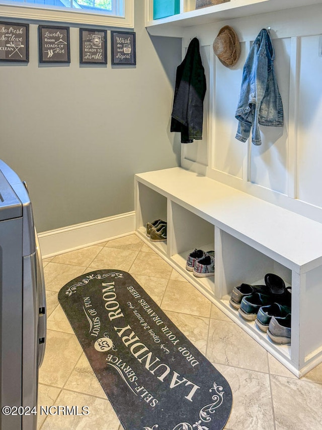 mudroom featuring tile patterned floors and washing machine and dryer