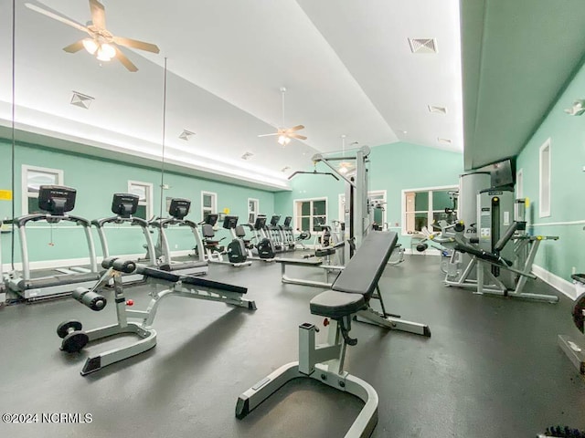 exercise room featuring ceiling fan and high vaulted ceiling