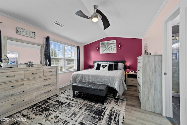 bedroom with light hardwood / wood-style flooring, vaulted ceiling, ceiling fan, and ornamental molding