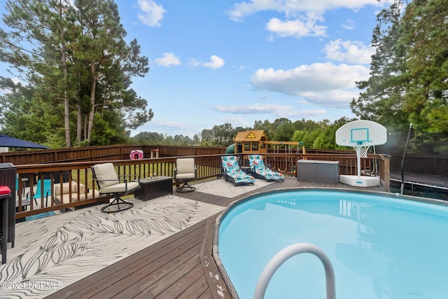 view of pool featuring a wooden deck