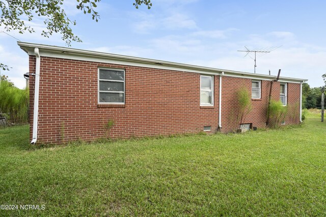 view of property exterior featuring a yard