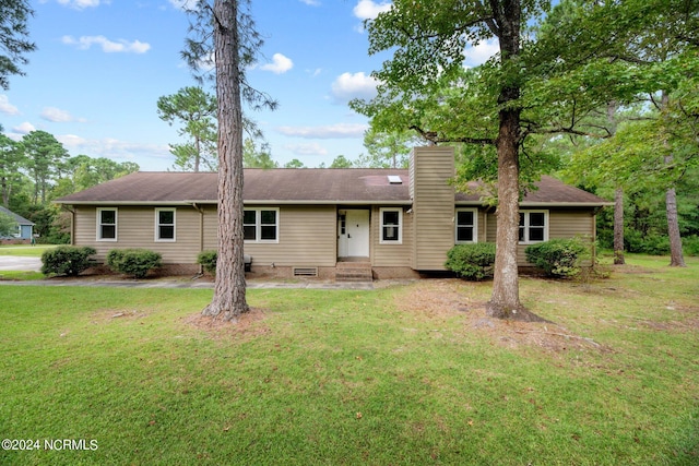 ranch-style home featuring a front yard