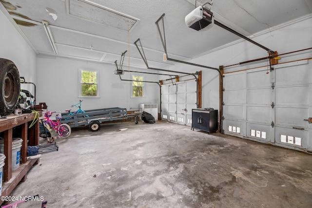 garage featuring a garage door opener