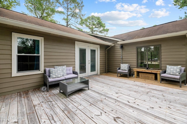 wooden terrace featuring french doors and an outdoor hangout area