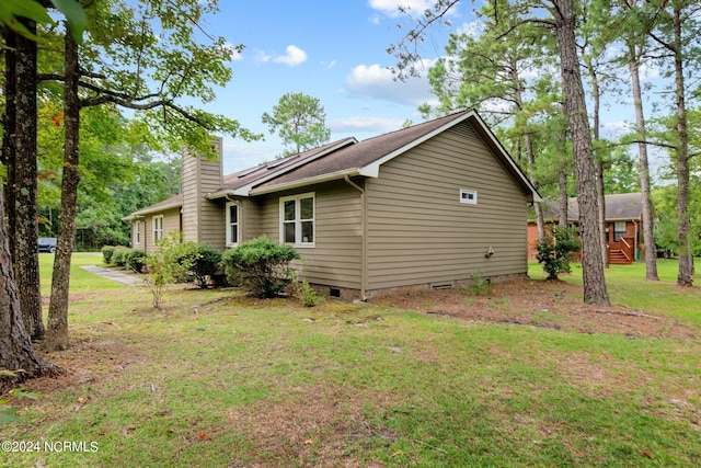 view of home's exterior featuring a lawn