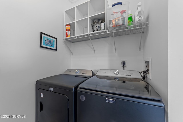 laundry area with independent washer and dryer