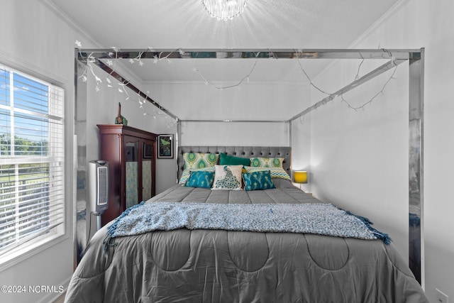 bedroom with ornamental molding