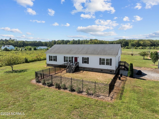 view of front of property with a rural view and a front yard