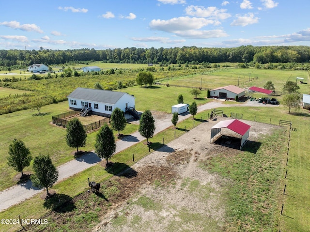 birds eye view of property featuring a rural view