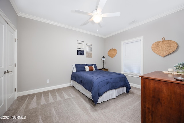 bedroom featuring ornamental molding, a closet, carpet, and ceiling fan