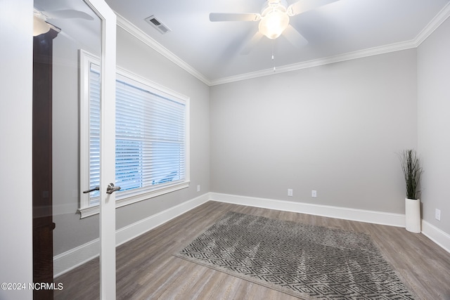 unfurnished room featuring ceiling fan, ornamental molding, and wood-type flooring