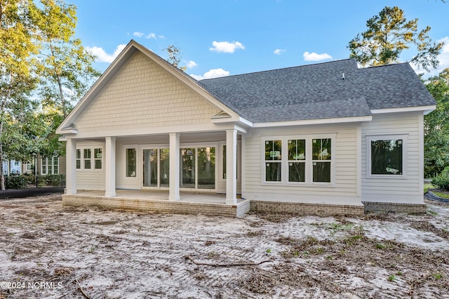 back of property with a patio